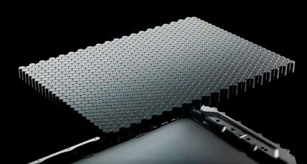 In the Tesla battery for electric vehicle, there are thousands of cylindrical lithium ion cells grouped together, which appear particularly dense on the chassis of four-wheel vehicle